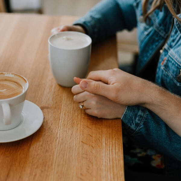 tabletop with hands holding