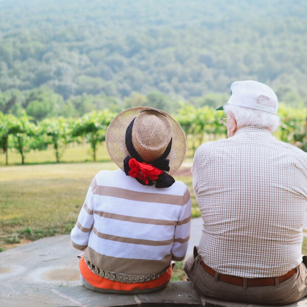 elderly couple relaxing on acrage