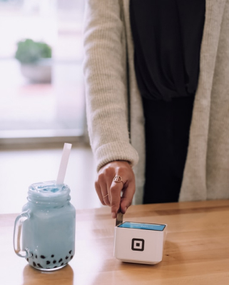 debit card being used at a shop