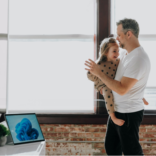 father and daughter sharing a moment dancing