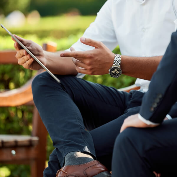 business owner with a tablet at a meeting