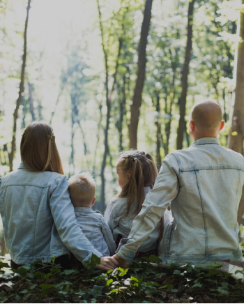 family enjoying a day in the woods
