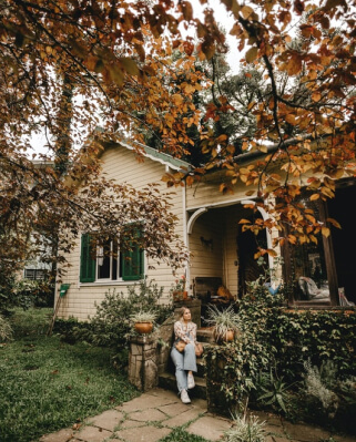 home owner sitting on front step of their home